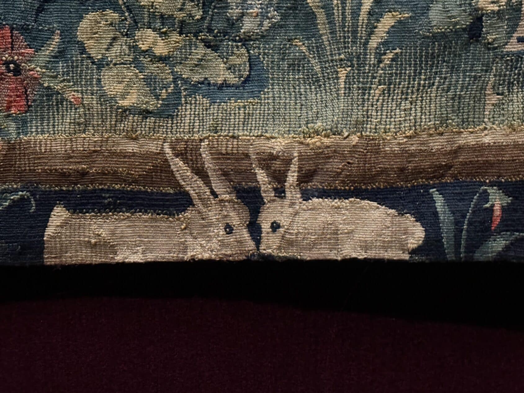 Rabbits in the mille-fleurs tapestry.