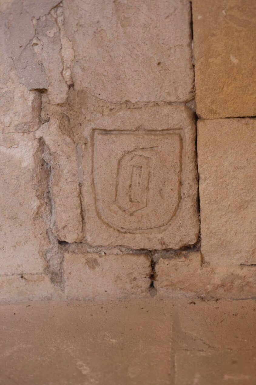 A carved coat of arms.